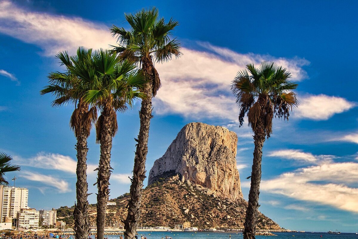 Palm trees framing the Penon de Ifach in Calpe