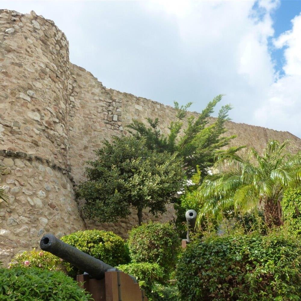 Torre&oacute; de la Pe&ccedil;a historic walls and cannons in Calpe