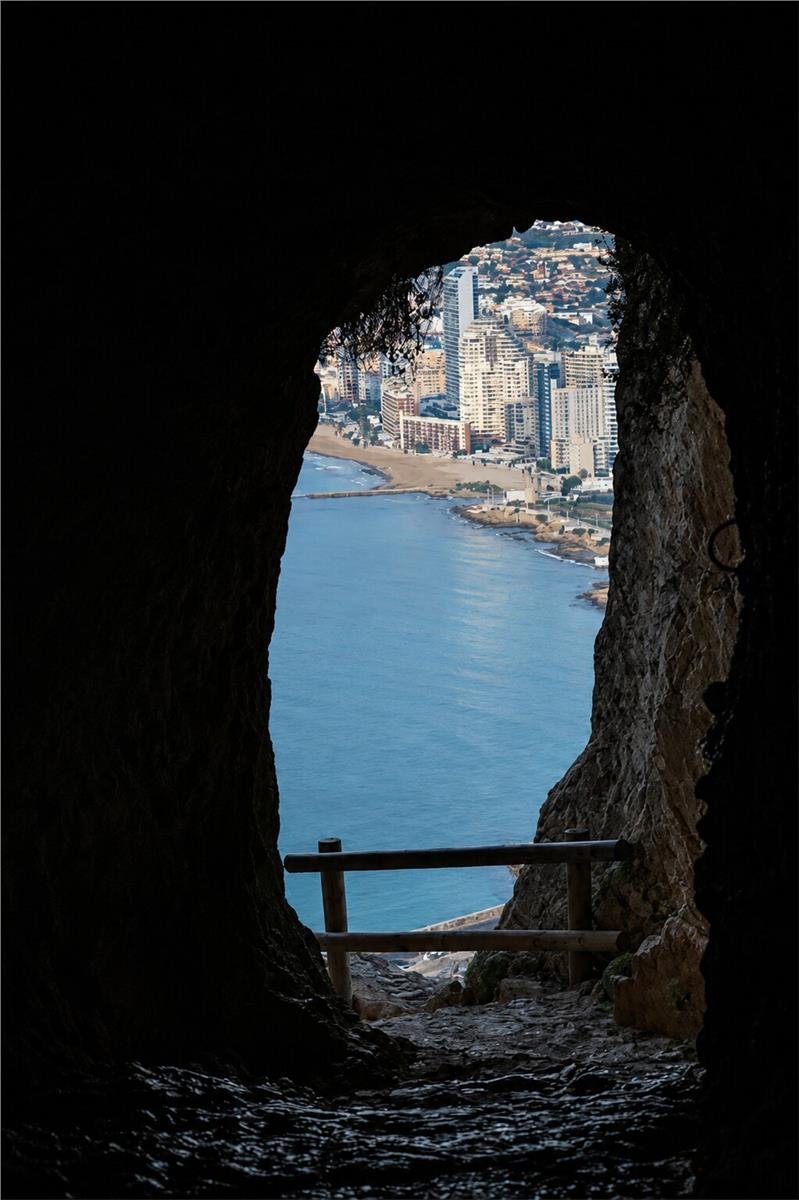 Calpe coastline viewed through the Penon de Ifach tunnel