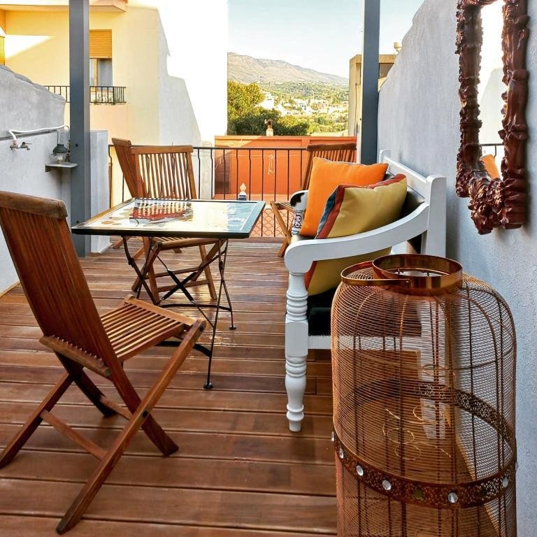 Colourful lounge and dining area on the lower terrace