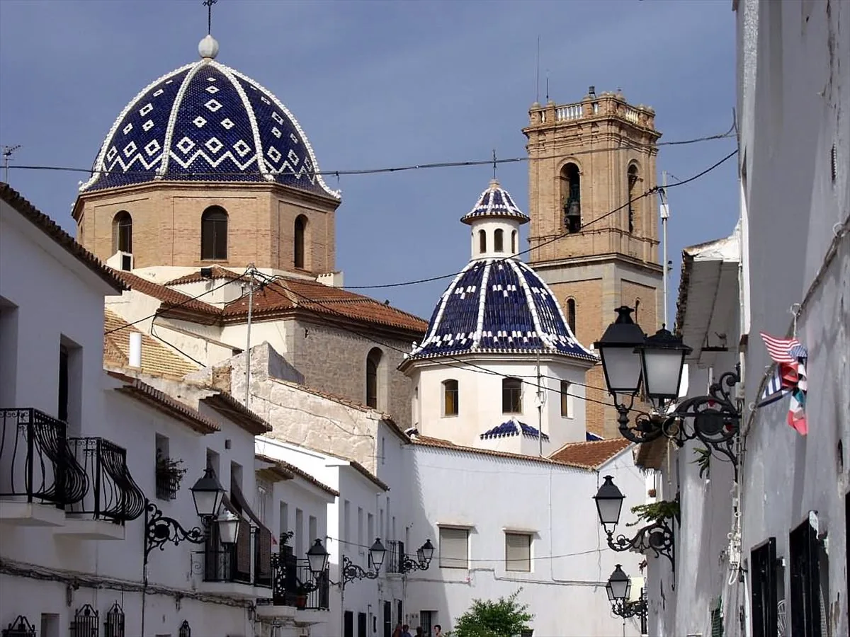 Altea old town street with the blue domes of Nuestra Senora del Consuelo