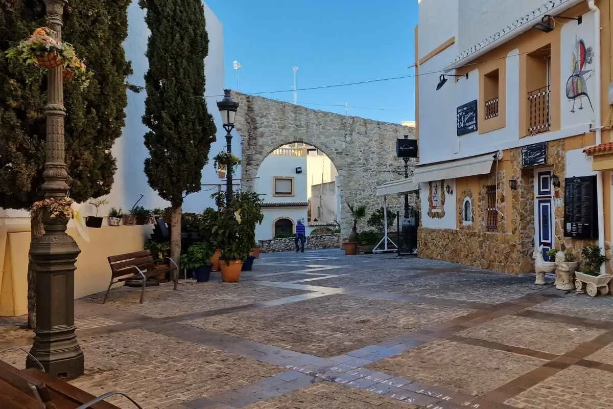 Historic square and stone arch in Calpe Old Town