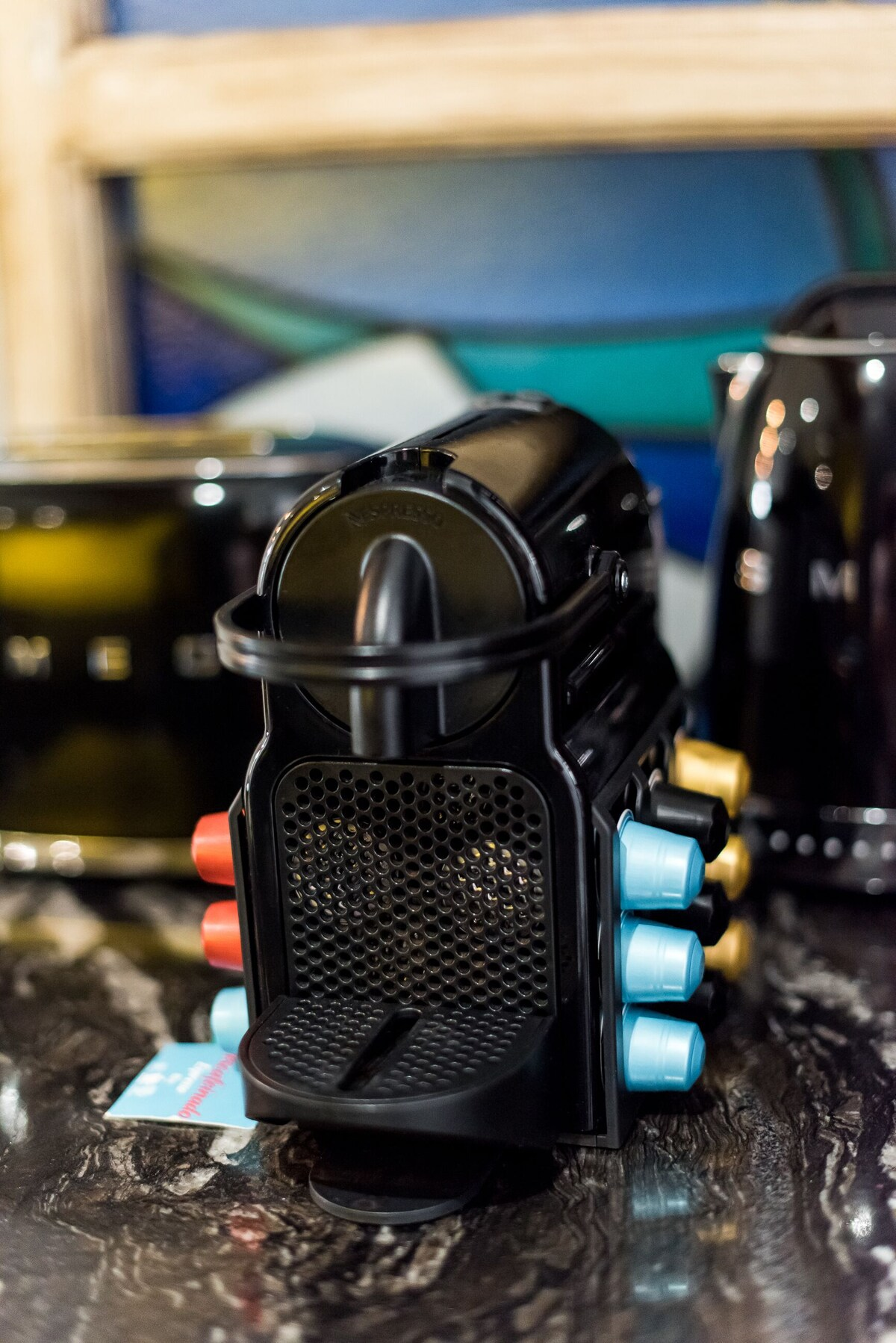 Casa Toro coffee machine with colourful capsules in the kitchen