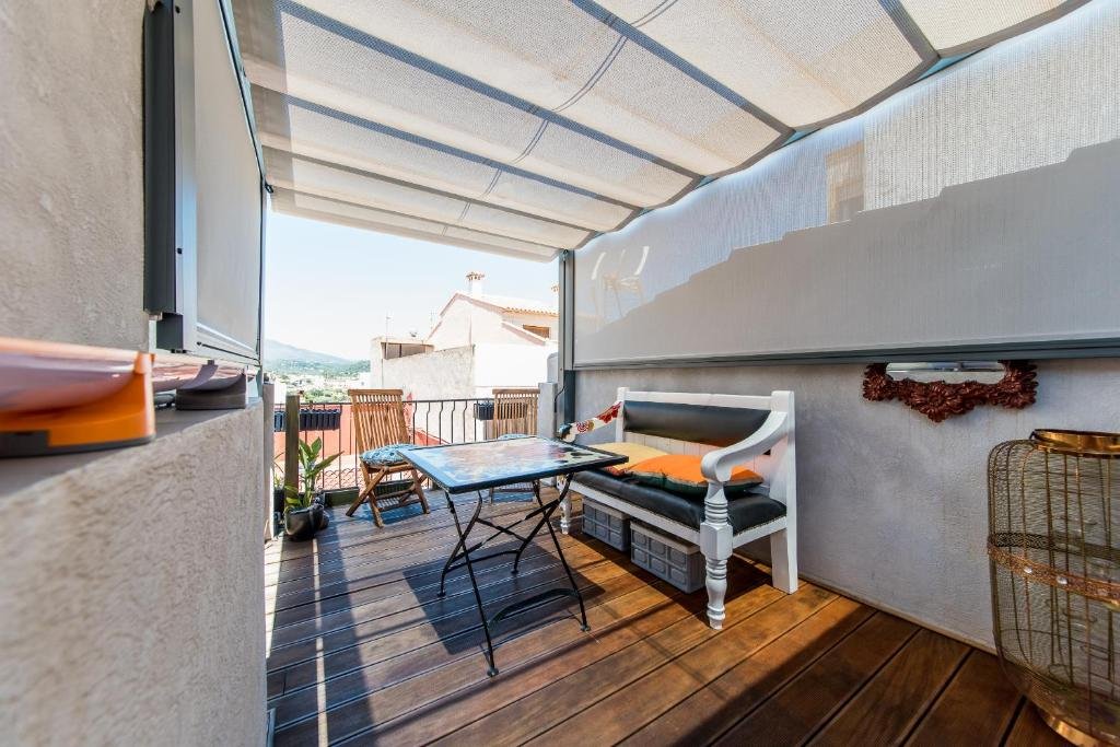 Dining table beneath the retractable canopy